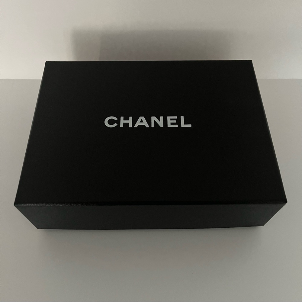 Chanel box with Chanel logo tissue paper